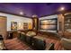 State-of-the-art home theater with plush seating and a large projection screen at 5507 Worsham Court, Windermere, FL 34786