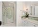 Modern bathroom with a walk-in shower and marble vanity at 5507 Worsham Court, Windermere, FL 34786