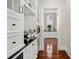 Butler's pantry with coffee bar, beverage center, and ample storage at 5507 Worsham Court, Windermere, FL 34786