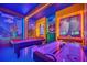 Fun game room with air hockey, pool table, and Mario theme at 6115 High Seas Dr, Orlando, FL 32821
