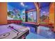 Game room featuring air hockey, pool table, and vibrant murals at 6115 High Seas Dr, Orlando, FL 32821