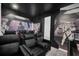 Home theater with black reclining chairs and Star Wars mural at 6115 High Seas Dr, Orlando, FL 32821