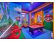 Fun game room with a pool table and vibrant Mario theme wall art at 6115 High Seas Dr, Orlando, FL 32821