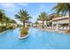 Tranquil resort pool with a waterfall feature and lounge chairs at 6115 High Seas Dr, Orlando, FL 32821
