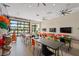 Community room with tables, chairs, and large screen TVs at 6115 High Seas Dr, Orlando, FL 32821