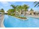Resort-style pool with a lazy river and palm trees at 6115 High Seas Dr, Orlando, FL 32821