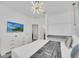 Main bedroom with large bed, TV, dresser, and walk-in closet at 6115 High Seas Dr, Orlando, FL 32821