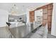 Modern dining room with a large table and gray chairs at 6115 High Seas Dr, Orlando, FL 32821