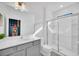 Bathroom with gray vanity, rocket mural, and glass shower at 6115 High Seas Dr, Orlando, FL 32821