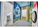 Themed bedroom with Minions mural, TV and ensuite bathroom at 6115 High Seas Dr, Orlando, FL 32821