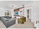 Spacious living room with modern furniture and a large TV at 6115 High Seas Dr, Orlando, FL 32821