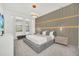 Spacious bedroom with a large bed and modern wall design at 6115 High Seas Dr, Orlando, FL 32821