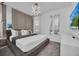 Spacious primary bedroom with large bed, TV, and ensuite bathroom access at 6115 High Seas Dr, Orlando, FL 32821