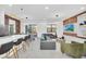 Open concept living area with modern furniture and large TV at 6115 High Seas Dr, Orlando, FL 32821