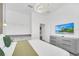 Guest bedroom with large bed, TV, dresser, and walk-in closet at 6115 High Seas Dr, Orlando, FL 32821