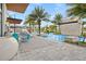 Resort-style pool area with lounge chairs and palm trees at 6115 High Seas Dr, Orlando, FL 32821