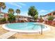 Community pool with surrounding patio furniture and landscaping at 2520 Caper Ln # 206, Maitland, FL 32751