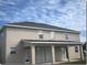 Two-story house with covered patio and large backyard at 2887 Sweetspire Cir, Kissimmee, FL 34746