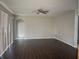Spacious living room featuring dark hardwood floors at 2887 Sweetspire Cir, Kissimmee, FL 34746