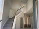 Elegant staircase leading to the second floor at 2887 Sweetspire Cir, Kissimmee, FL 34746