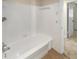 Simple bathroom with white bathtub and tiled walls at 326 Banyan Dr, Maitland, FL 32751