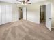 Large bedroom with plush carpeting and ample closet space at 326 Banyan Dr, Maitland, FL 32751