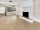 Bright living room featuring a fireplace and tile flooring at 326 Banyan Dr, Maitland, FL 32751