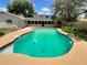 Inviting kidney shaped swimming pool in the backyard at 326 Banyan Dr, Maitland, FL 32751