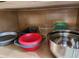 Kitchen cabinets with various pots, pans, and containers at 8947 Shine Dr, Kissimmee, FL 34747