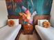 Twin bedroom with a tropical mural and matching decor at 8947 Shine Dr, Kissimmee, FL 34747