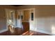Open living room with hardwood floors and archway at 120 S Thornton Ave, Orlando, FL 32801