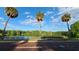Scenic view of a lake with palm trees and brick road at 120 S Thornton Ave, Orlando, FL 32801