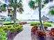Paved walkway winds through lush landscaping toward a lake at 3054 Pirate Way, Kissimmee, FL 34747