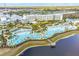 Aerial view of resort with pool and multiple buildings at 3054 Pirate Way, Kissimmee, FL 34747
