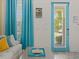 Bright and airy entryway with teal door and coastal decor at 3054 Pirate Way, Kissimmee, FL 34747