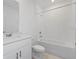 Clean bathroom with a bathtub and single vanity at 3606 Walking Stick Way, Poinciana, FL 34759
