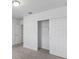 Well-lit bedroom with a large closet and sliding doors at 3606 Walking Stick Way, Poinciana, FL 34759