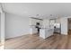 Open concept kitchen with white cabinets, stainless steel appliances and island at 3606 Walking Stick Way, Poinciana, FL 34759
