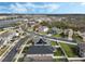 Aerial view showcasing the home's location in a beautiful neighborhood with a lake nearby at 3466 Halsway Dr, Orlando, FL 32824