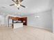 Open living room and kitchen area with tile floor at 346 Captiva Dr, Davenport, FL 33896