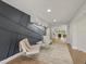 Open concept entryway with modern wall and seating area at 2612 Lafayette Ave, Winter Park, FL 32789