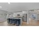 Open concept kitchen with a large island, stainless steel appliances, and plenty of cabinet space at 2612 Lafayette Ave, Winter Park, FL 32789