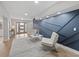 Bright and airy entryway with modern decor and hardwood floors at 2612 Lafayette Ave, Winter Park, FL 32789