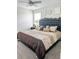 King-size bed in a well-lit bedroom with a ceiling fan at 4499 Magnolia Ridge Ct, Kissimmee, FL 34746