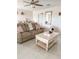 Relaxing sitting room with comfortable sofa and a white coffee table at 4499 Magnolia Ridge Ct, Kissimmee, FL 34746