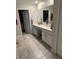 Double vanity bathroom with walk-in closet access at 4499 Magnolia Ridge Ct, Kissimmee, FL 34746
