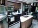 Modern kitchen with stainless steel appliances and an island at 3000 Clarcona Rd # 2710, Apopka, FL 32703