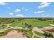 Aerial view of community with lush green golf course at 7593 Gathering Dr # 505, Reunion, FL 34747