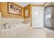 Spa-like bathroom with soaking tub and a separate glass shower at 7593 Gathering Dr # 505, Reunion, FL 34747