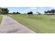 Pathway alongside a beautifully landscaped golf course at 7593 Gathering Dr # 505, Reunion, FL 34747
